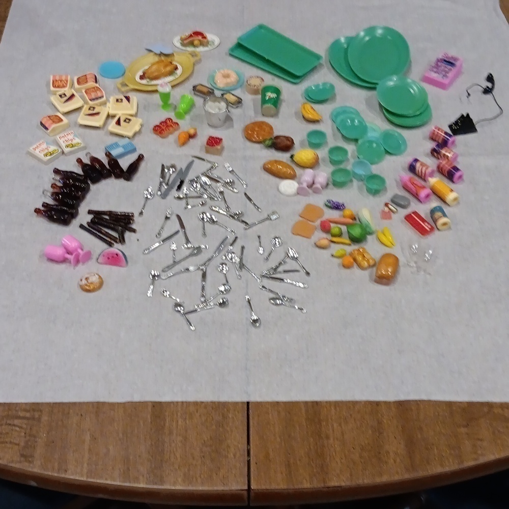 Small doll assortment of dishes and food items